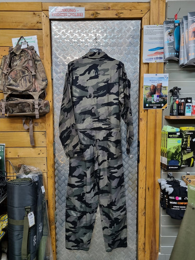 Camouflage snowsuit hanging on a display rack in a store setting