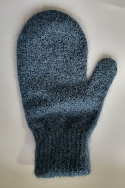 Blue knitted mitten on a white background