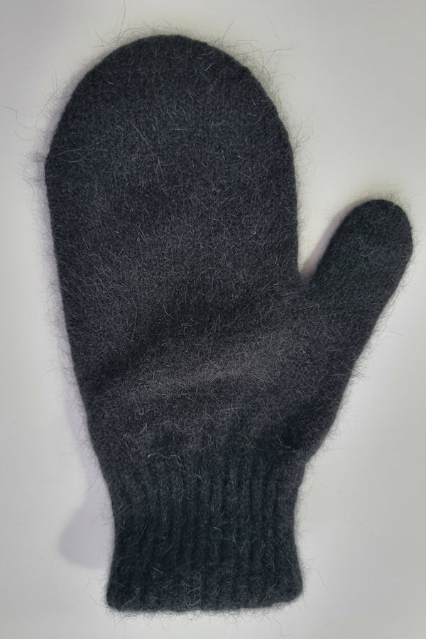 Dark gray knitted mitten on a light gray background