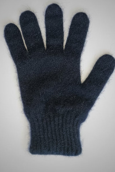 Blue knitted glove on a gray background