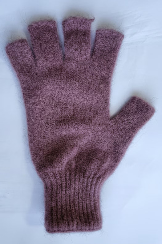 Purple fingerless glove on a white background
