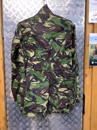 Camouflage jacket on a metallic surface