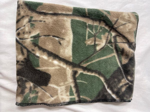 Camouflage-patterned blanket on a white background