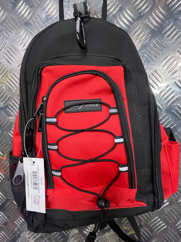 Black and red backpack on a metallic surface
