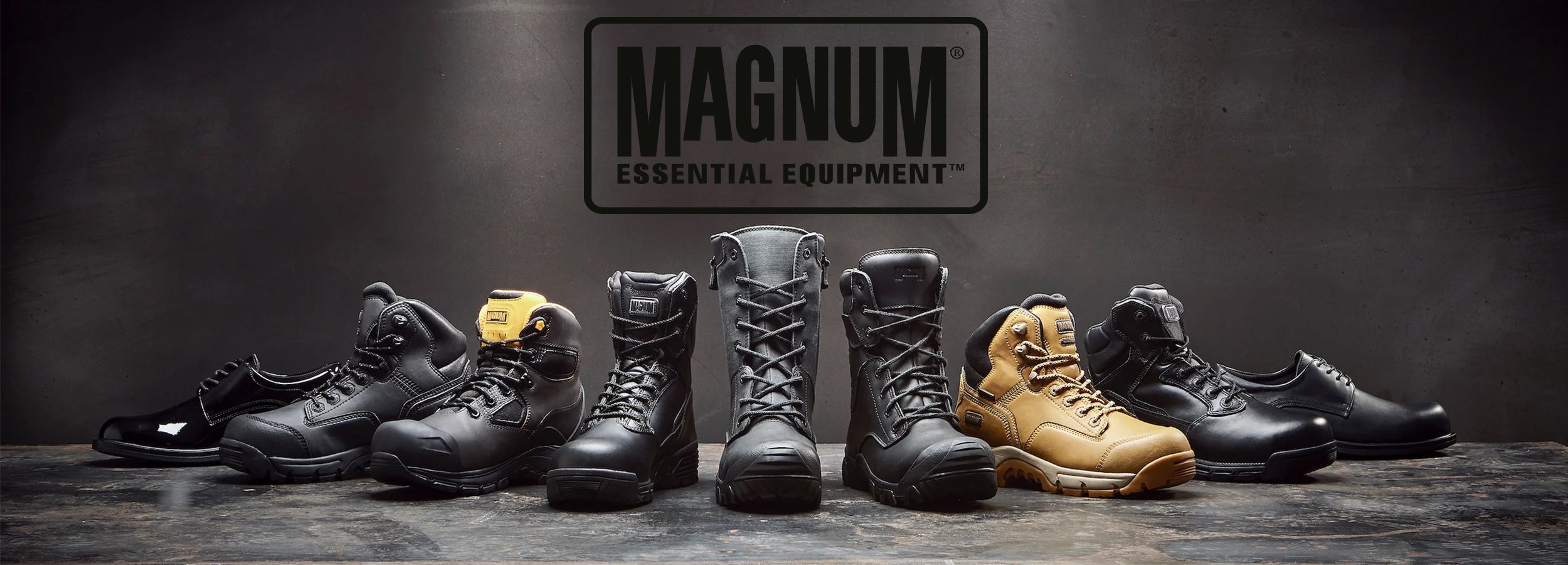 Row of black and tan boots with Magnum logo on a dark background