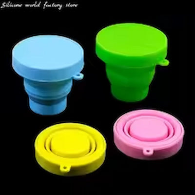 Four colorful silicone bottle caps on a black background