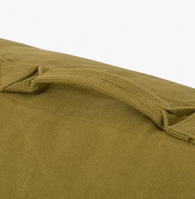 Close-up of a green fabric texture on a white background