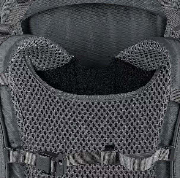 Close-up of a tactical backpack with mesh padding and straps.
