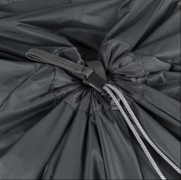 Close-up of a drawstring on a dark gray bag