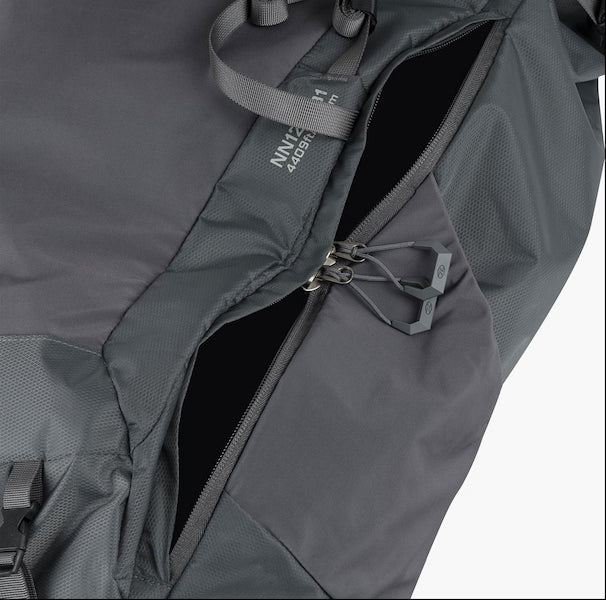 Close-up of a gray backpack with a visible brand logo on a white background