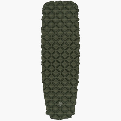 Green quilted sleeping pad on a white background