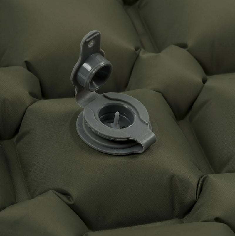 Gray valve on a green inflatable mattress
