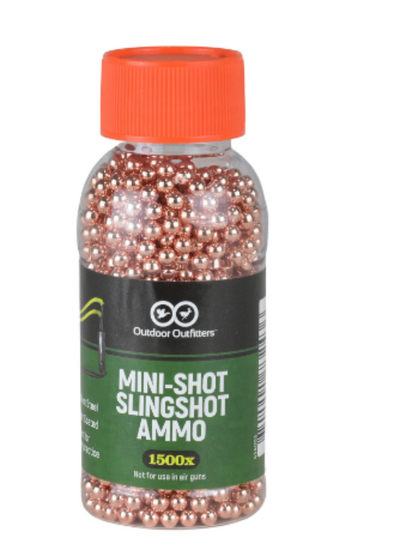A clear plastic bottle with red cap containing copper coated steel mini-shot slingshot ammo, labeled 'MINI-SHOT SLINGSHOT AMMO 1500 rounds'.