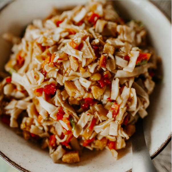 pasta dish with vegetables in a bowl