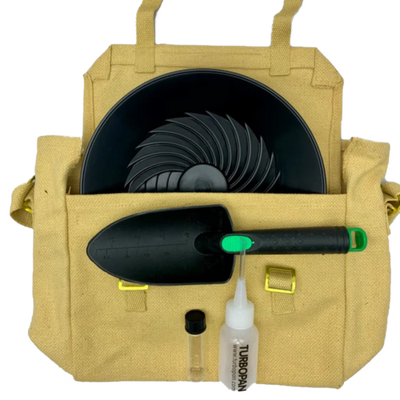 Beige tool bag with garden tools including a trowel, spray bottle, and black container on a white background.