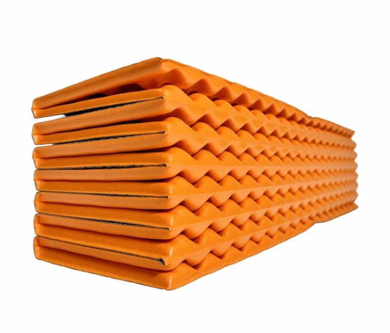 Stack of orange foam rollers on a white background