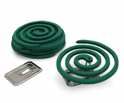 Two green mosquito coils with a metal clip on a white background