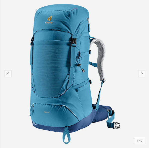 A Deuter hiking backpack in a vibrant blue color, shown from a three-quarters angle against a light gray background.