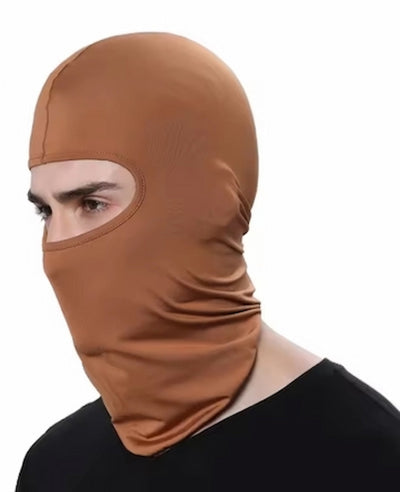 Person wearing a brown balaclava on a white background