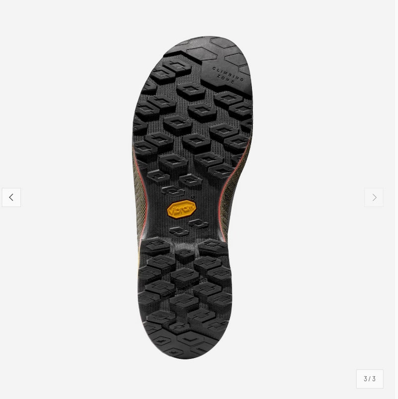 Close-up of a shoe sole with a brand logo on a white background