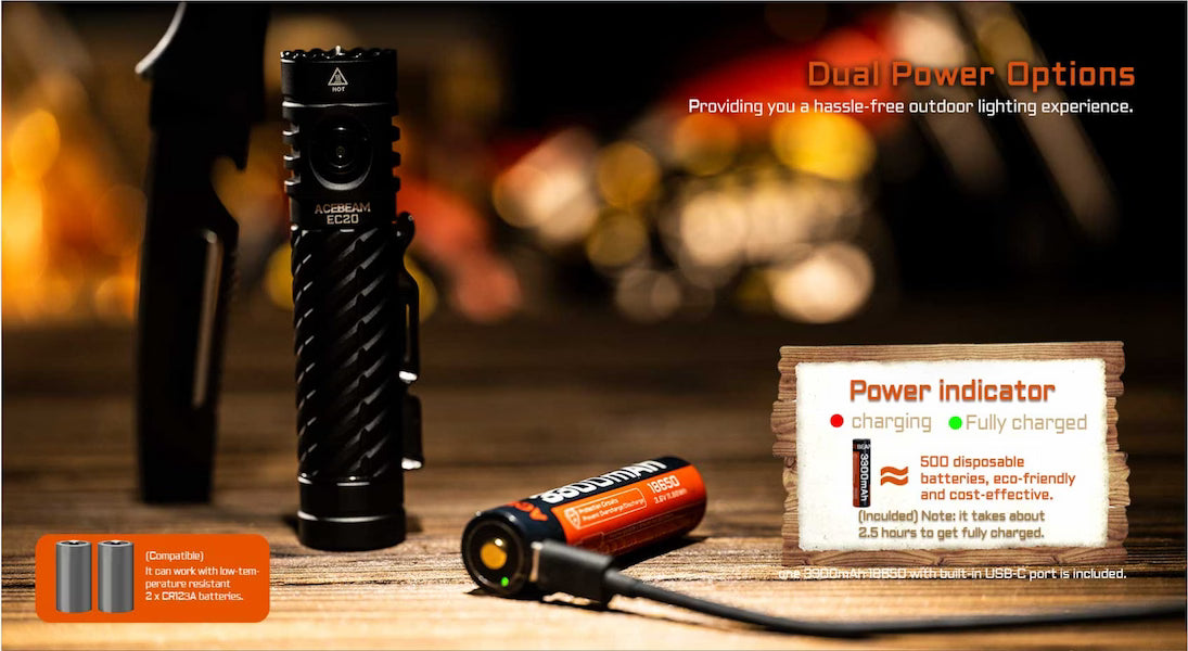 Black flashlight with batteries and power indicator on a wooden surface