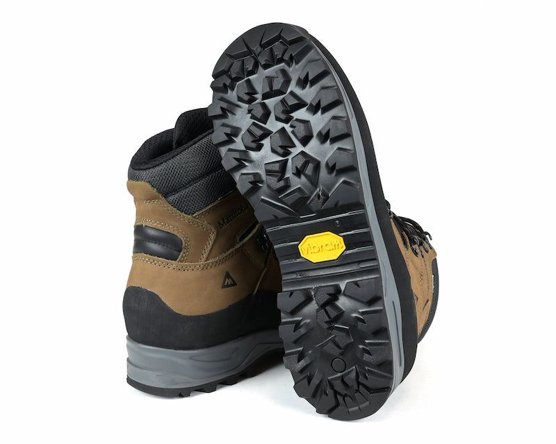 Brown and black hiking boot with a close-up of the sole on a white background