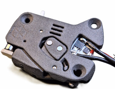 Close-up of a mechanical device with wiring on a white background