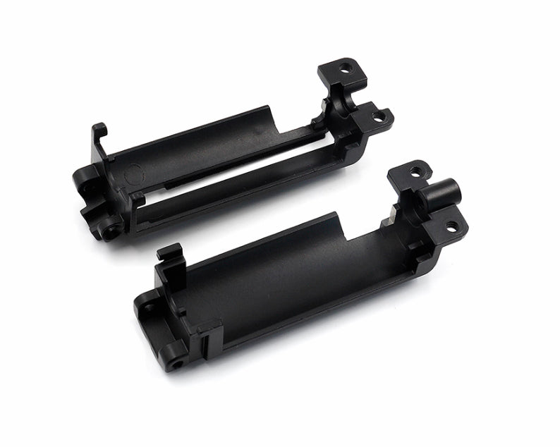 Two black metal brackets on a white background