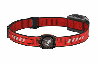 A red and black reflective headlamp band with a central black circular dial and a black side adjustment buckle, shown on a plain white background.
