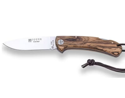 Folding knife with wooden handle and leather thong on a white background