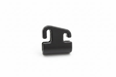 A small black plastic clip or hook-shaped fastener component, photographed on a clean white background.