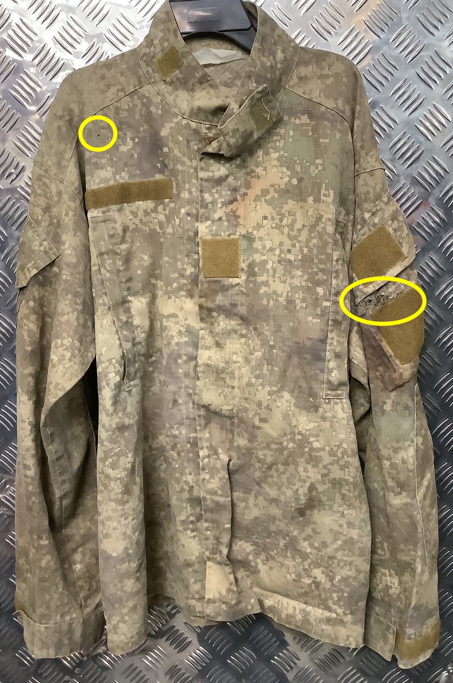 Digital camo airsoft combat shirt with visible marks and small holes.