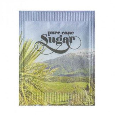 A sugar sachet with 'pure cane Sugar' text and a background depicting a lush landscape with mountains.
