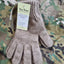 Pair of brown gloves with a tag on a camouflage background