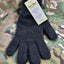 Dark gray glove with a tag on a camouflage background