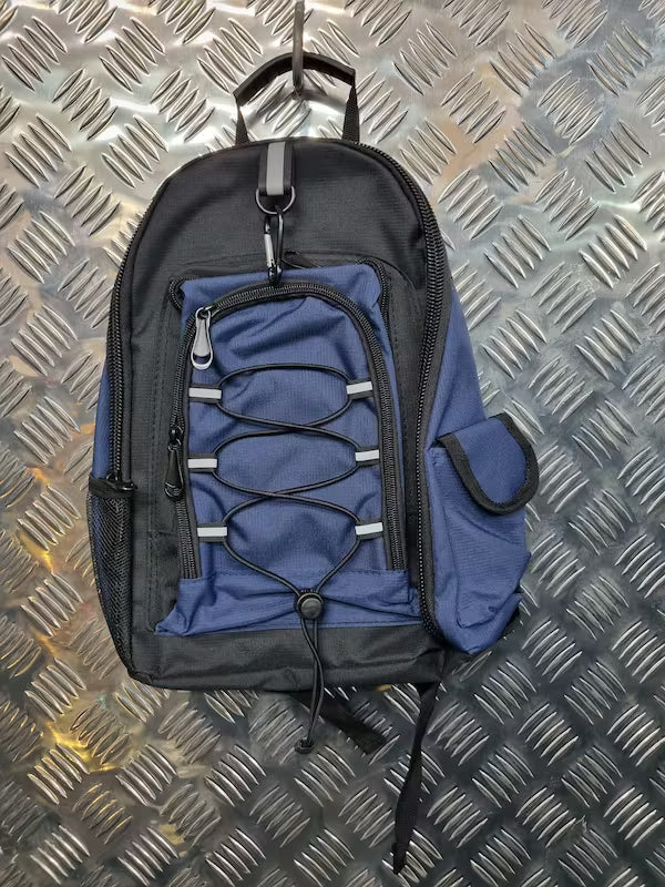 Blue and black backpack on a metallic diamond plate background