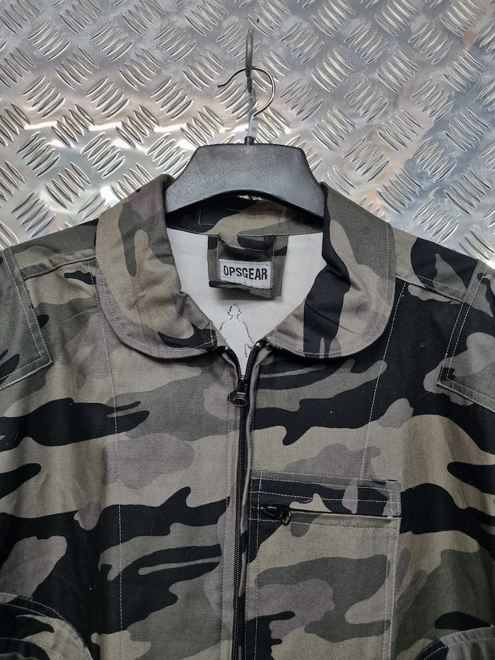 Camouflage jacket on a hanger against a metallic background