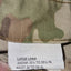 Camouflage pants with a size label indicating 'Large Long' measurements.
