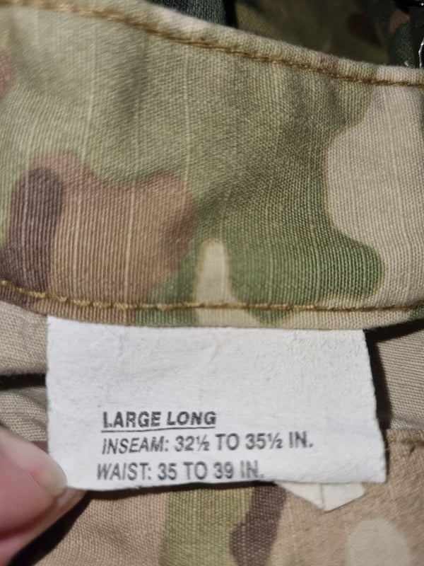 Camouflage pants with a size label indicating 'Large Long' measurements.
