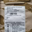 Label on a camouflage jacket with text and care instructions.