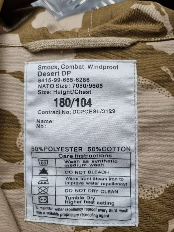 Label on a camouflage jacket with text and care instructions.