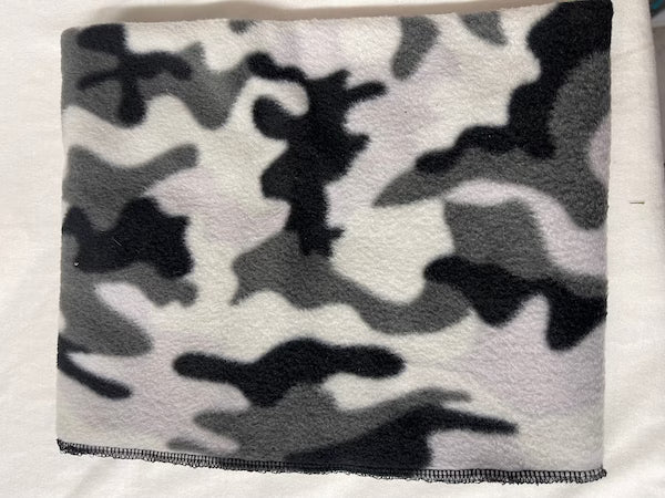 Camouflage-patterned blanket on a white background