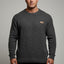 Man wearing a gray sweater with a small logo on a gray background