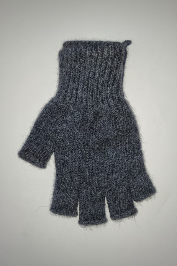 Gray knitted glove on a light gray background
