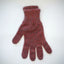 Red knitted glove on a white background