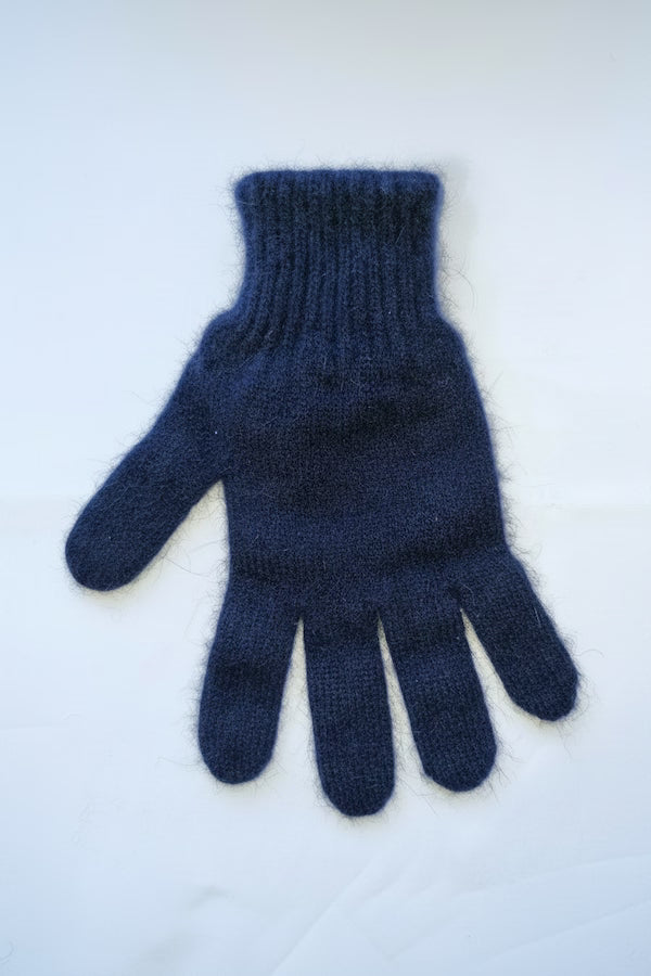 Blue knitted glove on a white background