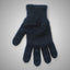 Blue knitted glove on a gray background