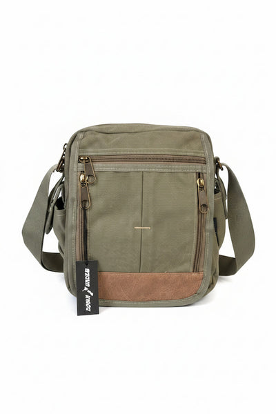 Green and brown crossbody bag with a visible brand label on a white background