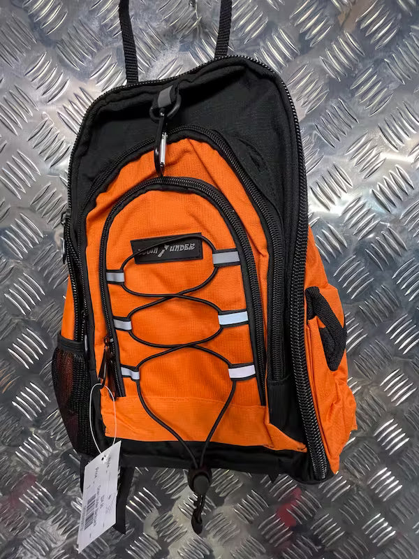 Orange and black backpack on a metallic surface