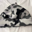 Camouflage-patterned beanie on a white background